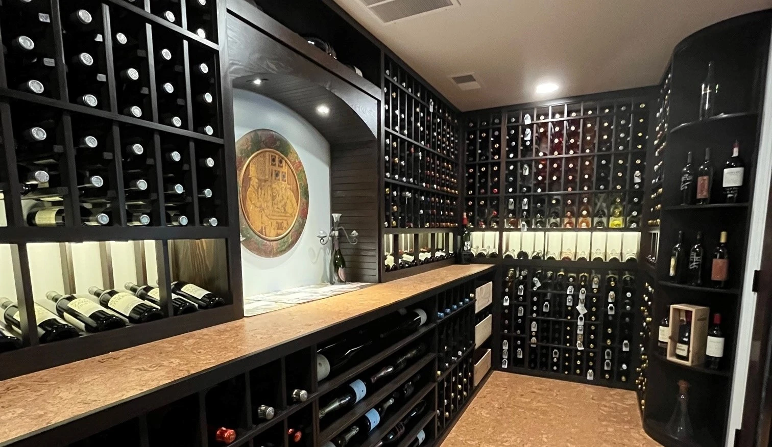 Luxury custom wine cellar crafted with premium redwood and espresso stain, filled with wine bottles